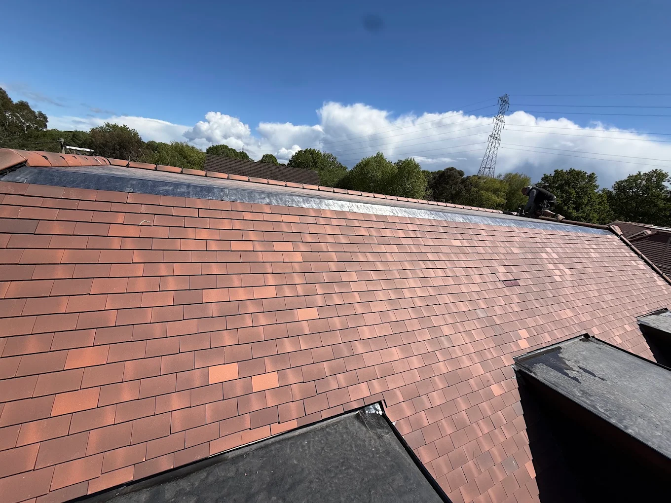 New clay tiled roof with a lead valley, laid by PWA Roofing