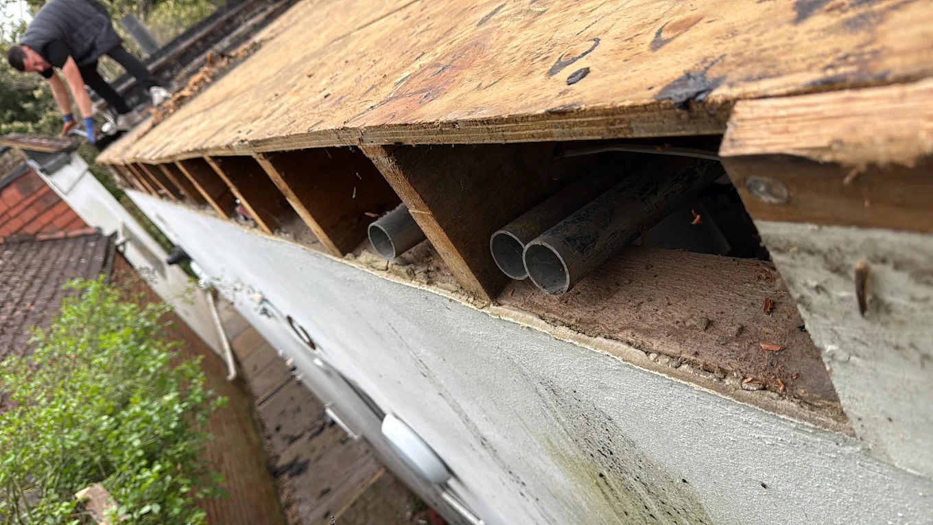 Eaves detail with new fascia board, rafter feet and guttering