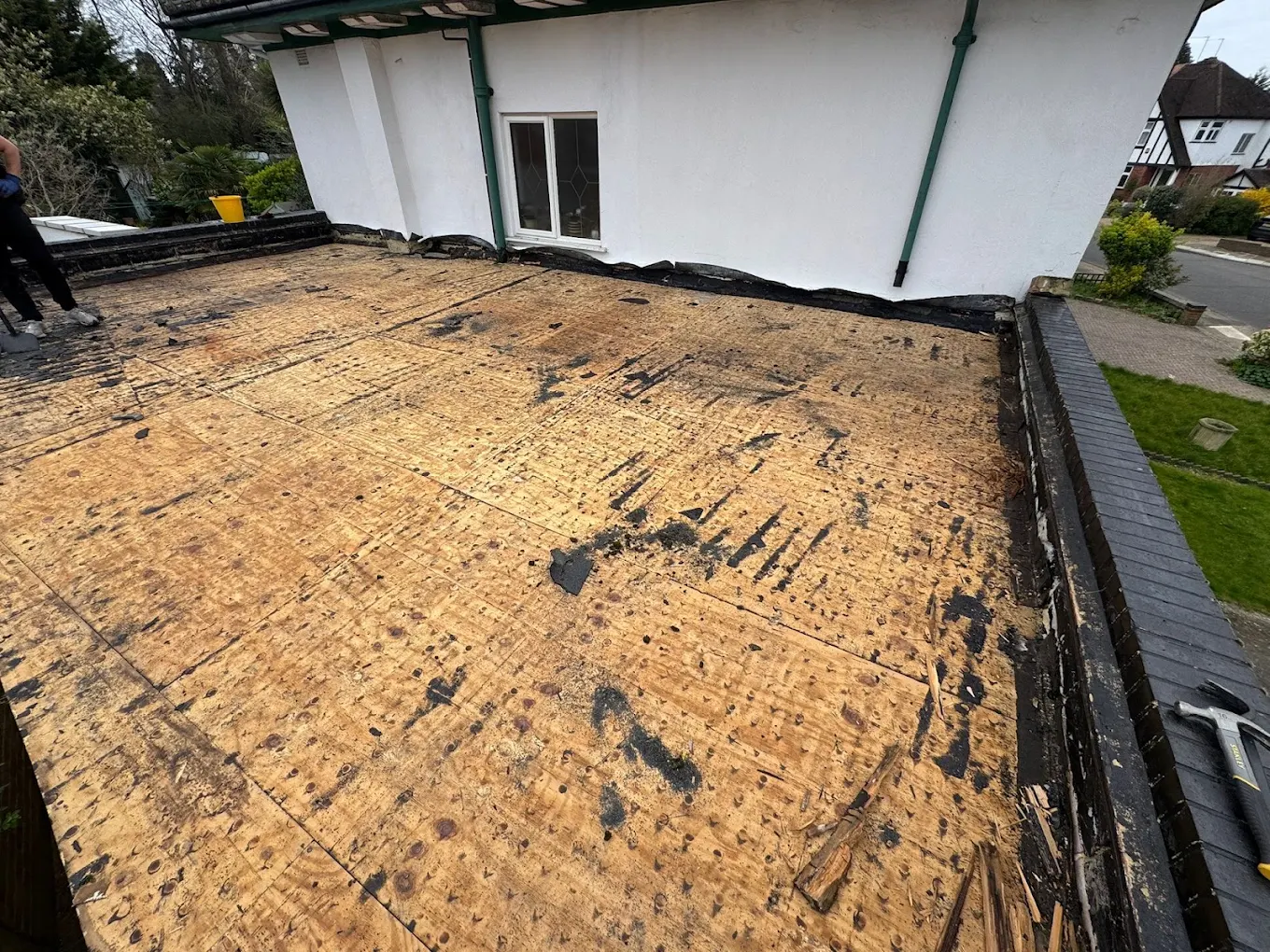 Old flat roof stripped back to the boards before the new deck goes down