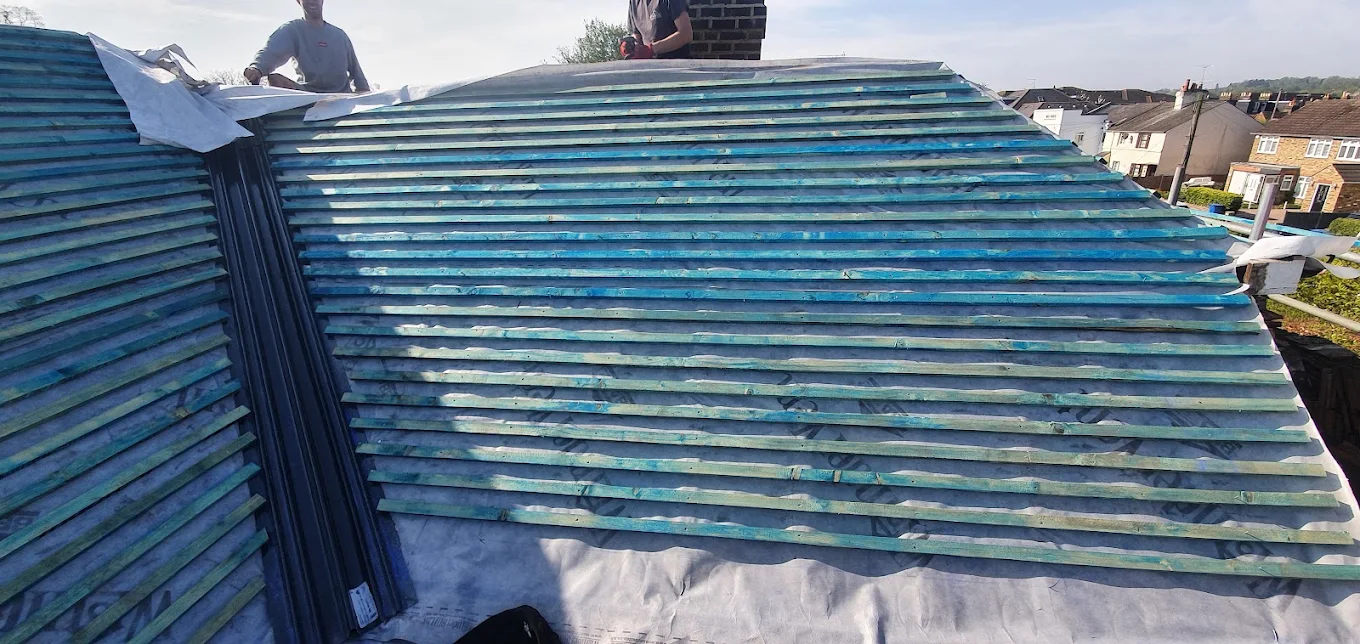 Roof stripped, felted and battened out across a whole elevation, ready for tiles